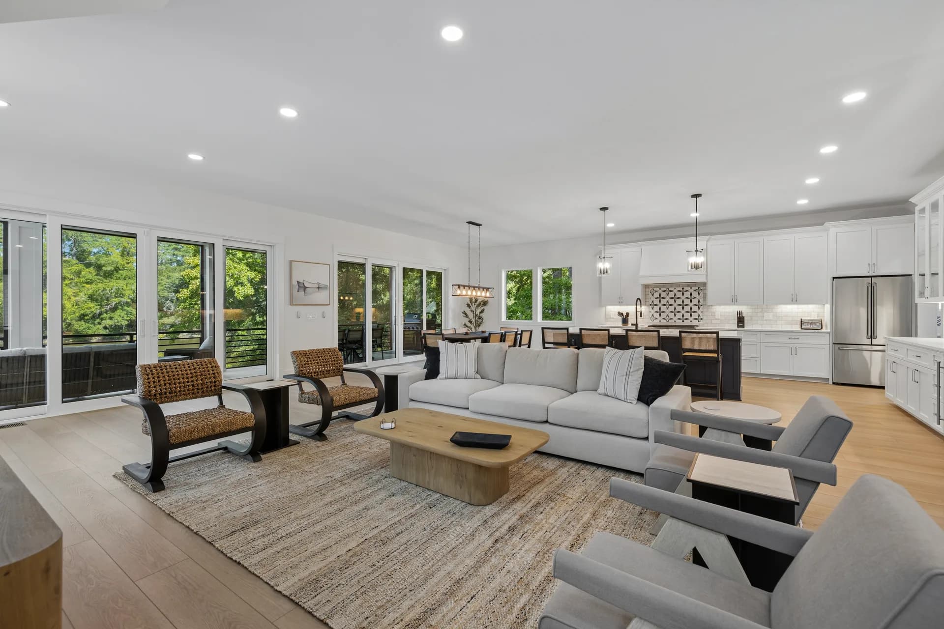 Main living area with sofa, coffee table, kitchen and dining beyond at 16 Indigo Lane