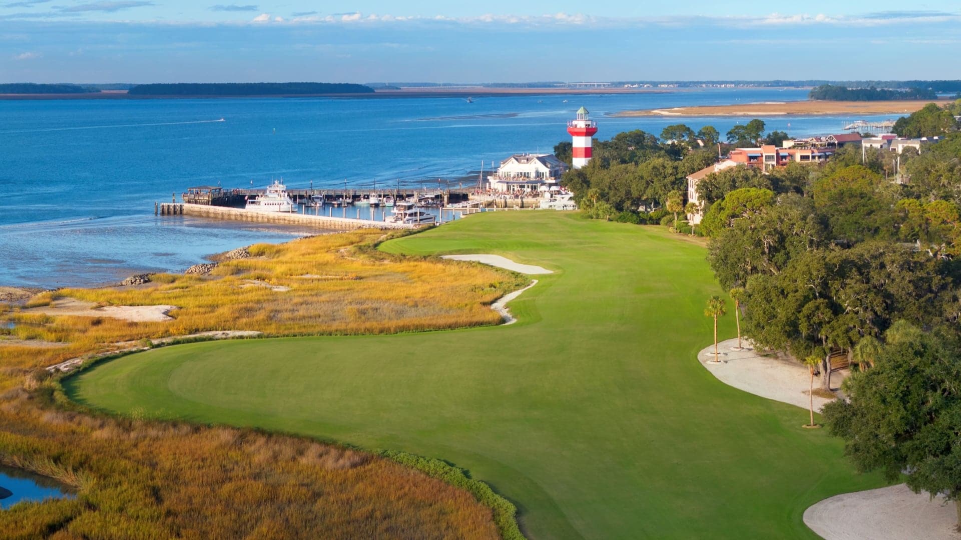 The 18th hole at Harbour Town Golf Links with the lighthouse and Calibogue Sound beyond the fairway