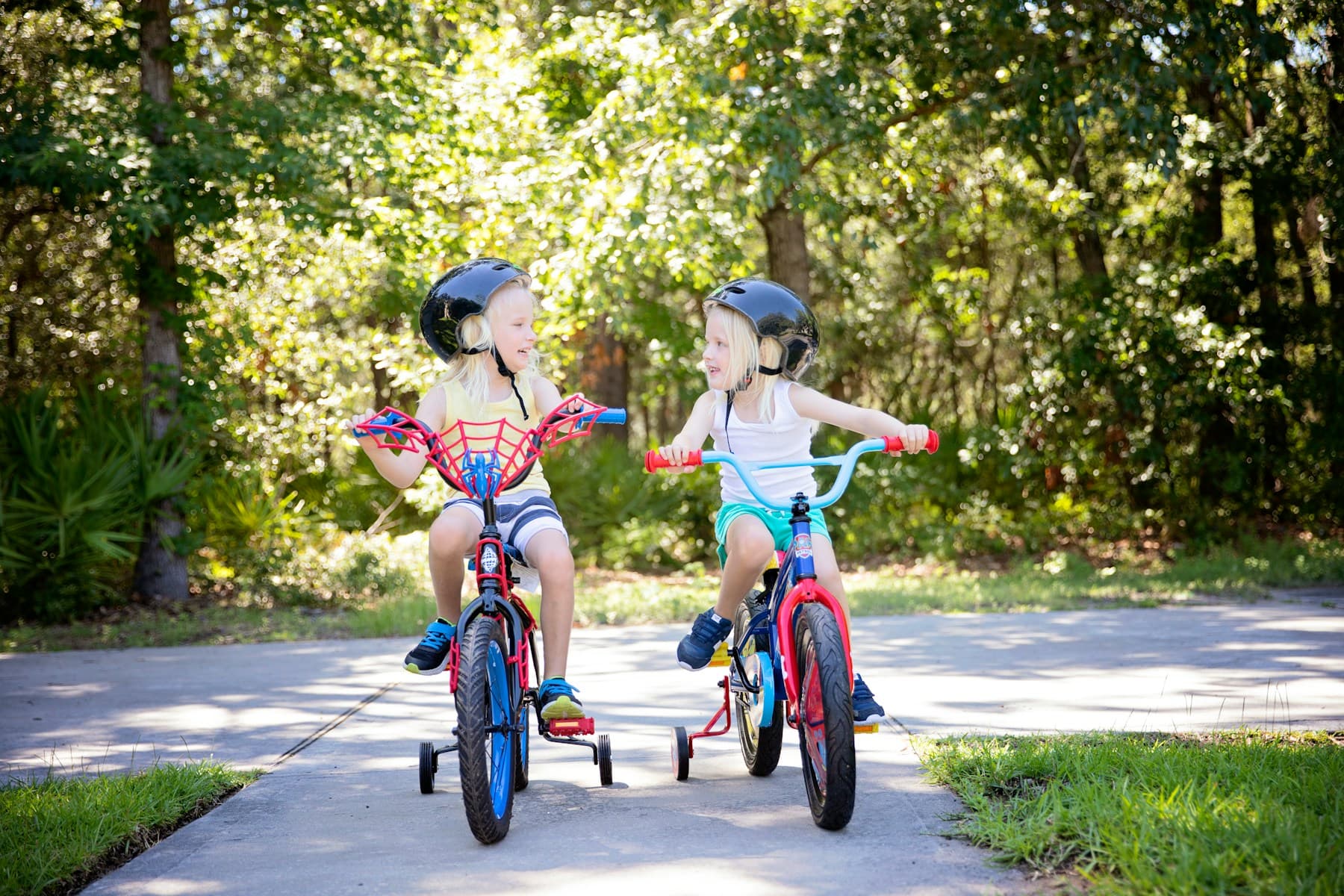 Children riding bicycles beneath trees on Hilton Head Island
